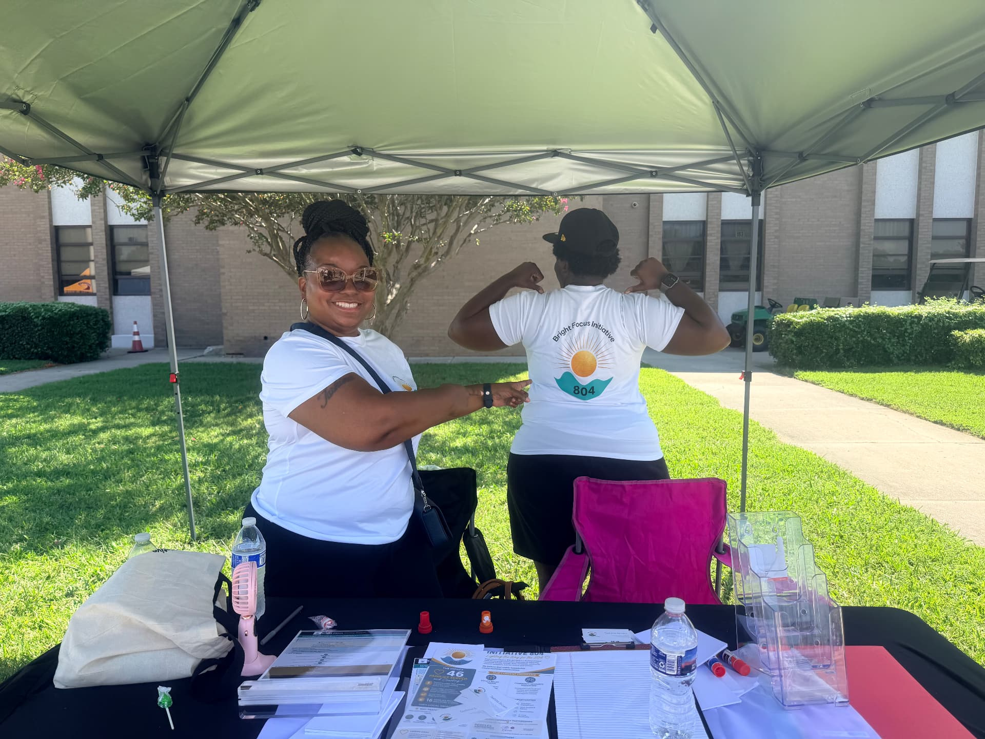 Volunteers showing off the Bright Focus Initiative 804 logo on their shirts